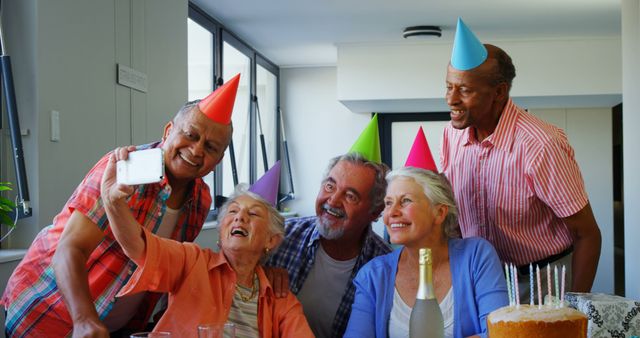 Senior Friends Enjoying Birthday Celebration with Cake - Download Free Stock Images Pikwizard.com