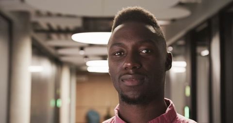 Confident Man in Modern Office Corridor with Contemporary Design
