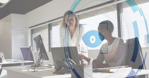 Business professionals collaborating in modern office with technology overlays