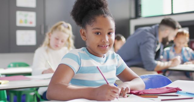 Smiling African American Schoolgirl in a Diverse Classroom - Download Free Stock Images Pikwizard.com