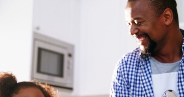 African American Father and Daughter Enjoying Cooking Together in Kitchen - Download Free Stock Images Pikwizard.com