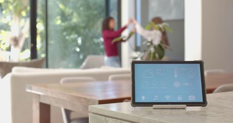 Smart Tablet on Countertop with Women Enjoying Quality Time