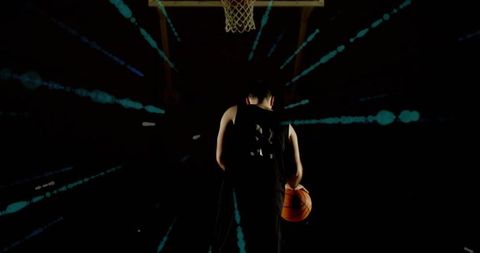 Dynamic Athlete Holding Basketball with Digital Effects