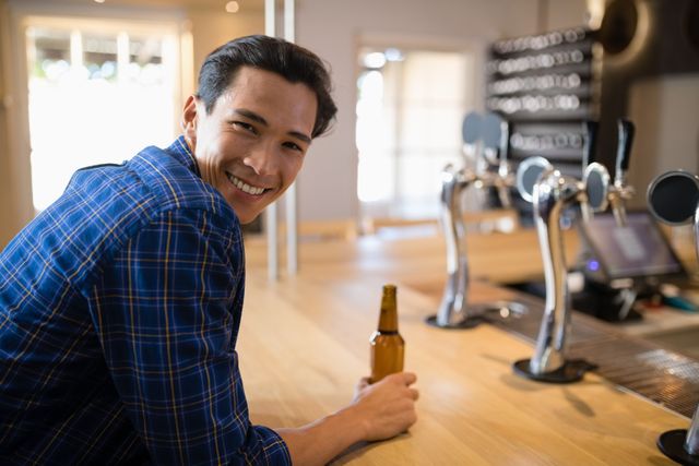 Man Enjoying Beer at Bar Counter - Download Free Stock Photos Pikwizard.com