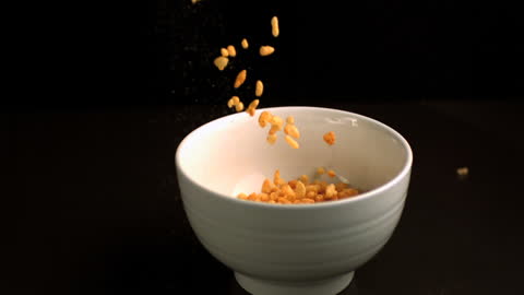 Rice Cereal Falling Into Bowl in Slow Motion