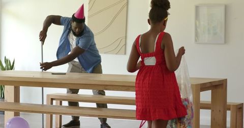 Family tidying up after celebration at home