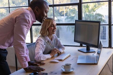 Diverse Coworkers Collaborating in Bright Office