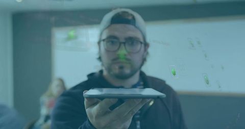 College student demonstrating tablet-based augmented reality demo in classroom
