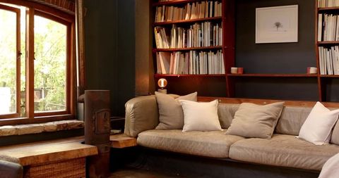 Cozy rustic living room with beige sofa and wooden accents