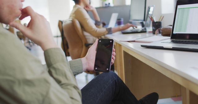 Office Worker Holding Smartphone and Contemplating - Download Free Stock Images Pikwizard.com