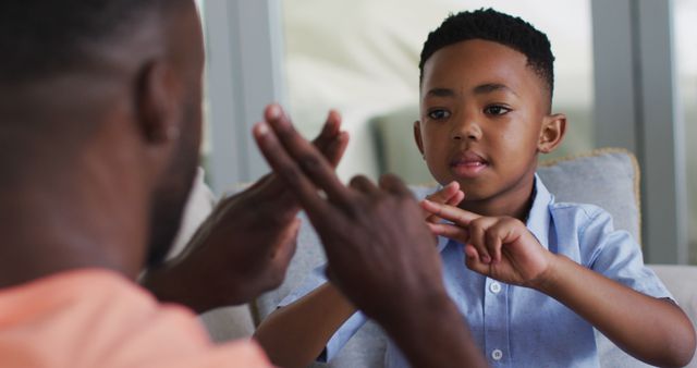 Father and Son Using Sign Language at Home - Download Free Stock Images Pikwizard.com