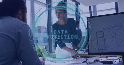 Elegant Businesswoman Discussing Architectural Plans in Office