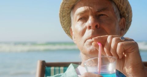 Elderly Man Enjoys Relaxing Beach Cocktail Vacation