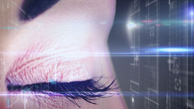 Animation shows a close-up of a female eye set against a backlit grid of digital data visuals. They denote the merging of human capabilities with advanced technology, symbolizing concepts like cybersecurity, artificial intelligence, and data analytics. Ideal for use in media related to technology development, digital transformation, innovative breakthroughs, modern science stories, or virtual and augmented reality interfaces.