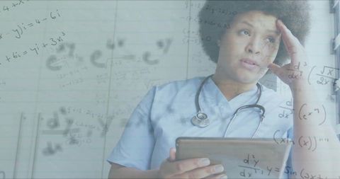 Nurse Reviewing Data in Hospital with Digital Technology