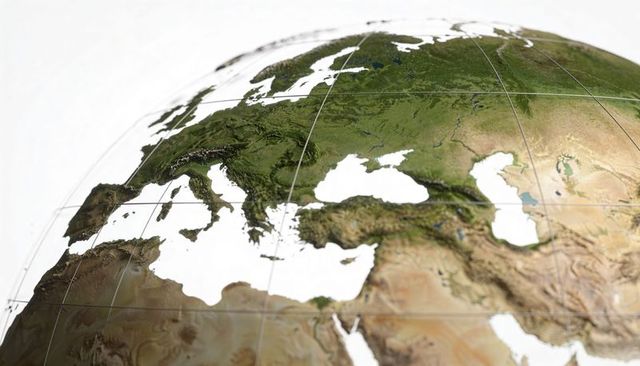 Rotating globe showing europe mediterranean north africa terrain with relief and grid lines