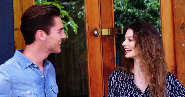 Smiling couple in casual conversation outside, natural light - Download Free Stock Images Pikwizard.com