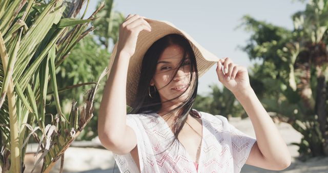 Hispanic Woman Enjoying Sunny Beach in Sunhat and Sundress - Download Free Stock Images Pikwizard.com