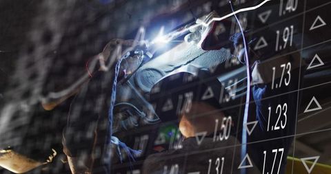 Female Welder Welding Metal with Financial Data Overlay, Industrial Fabrication Analytics