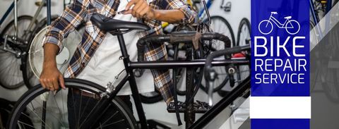 Bicycle mechanic working tire with expertise in repair shop