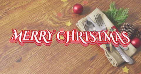 this image presents a classic christmas greeting set over an elegant display of cutlery and seasonal decorations on a wooden table. it can be used for holiday cards, seasonal invitations, festive templates, or social media posts that aim to convey a warm and cheerful holiday spirit.