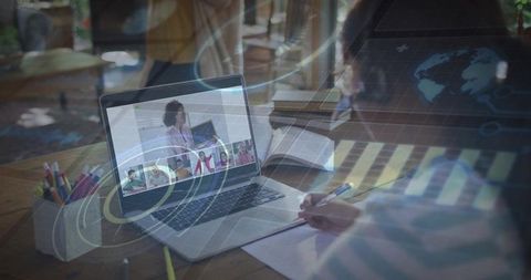 Child studying at home during live online class with teacher on laptop and globe overlay