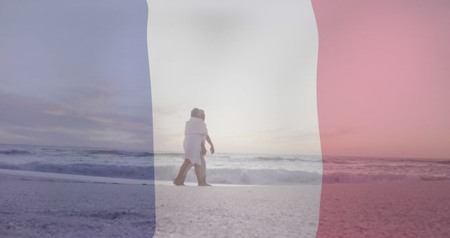 Couple wrapped in blankets is walking on serene beach with beautiful sunset in the background. French flag overlay creates a unique effect. Suitable for travel posters, romance novels, France tourism promotions, and greeting cards.