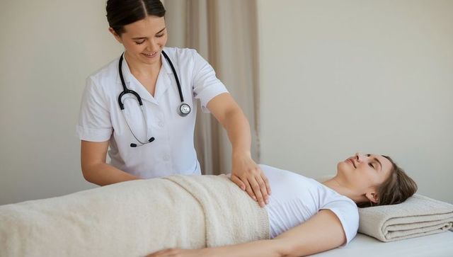 Healthcare professional engaging in abdominal check on relaxing patient