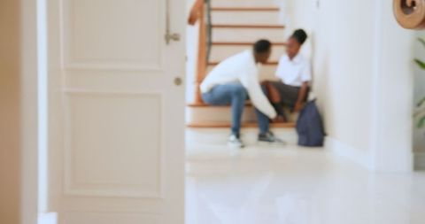 Father and Daughter Bonding at Home on Staircase