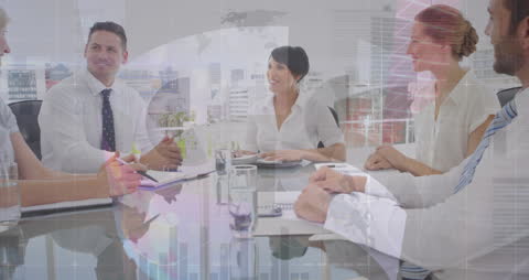 Mixed Ethnicity Team Discussing Financial Strategy in Modern Office