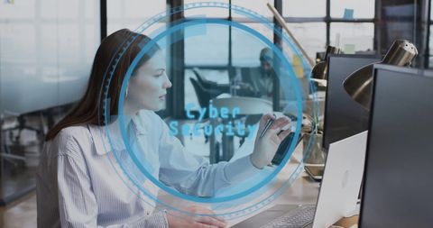 Businesswoman Engaging in Cybersecurity on Laptop in Modern Office - Download Free Stock Images Pikwizard.com