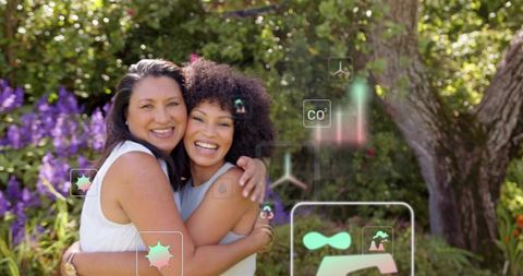 Women hugging in sunlit garden with augmented eco hud overlays, smiling joyful friendship