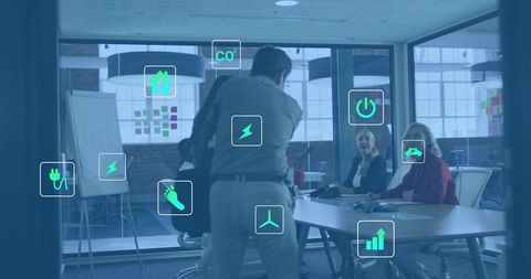 Leader Presenting Sustainable Energy Strategy in Modern Glass Boardroom with Digital Icons