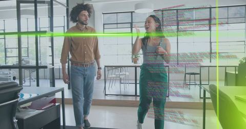 Young professionals walking through modern glass office with AR green scan and glitch effects