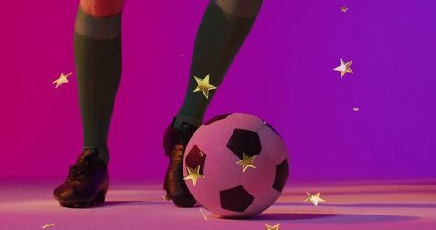 Soccer player positioned with soccer ball and animated gold stars
