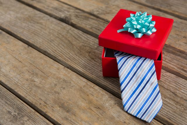 High angle view of necktie in gift box on wooden table