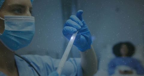 Nurse in Hospital Room Analyzing Sample for Diagnostic Purposes
