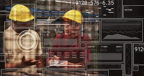 Industrial workers examining augmented reality dashboards while collaborating on plant operations