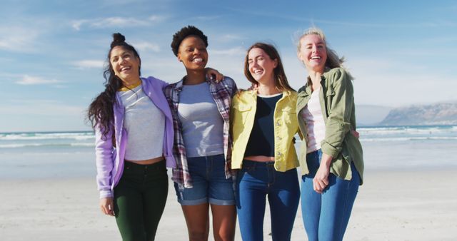Portrait of happy group of diverse female friends having fun, laughing at the beach. holiday, freedom and leisure time outdoors.