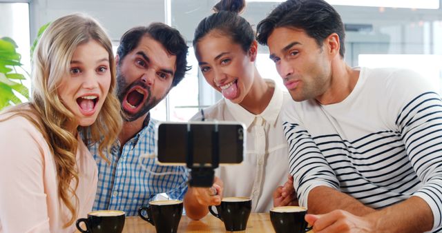 Friends Taking Selfie at Coffee Shop Making Silly Faces - Download Free Stock Images Pikwizard.com