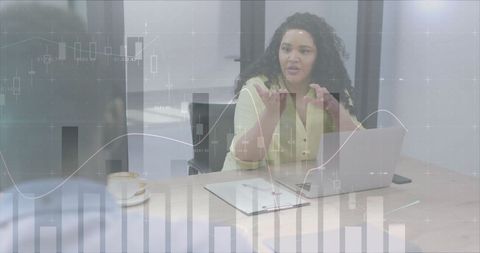 Diverse Business Discussion with Financial Graph Overlay