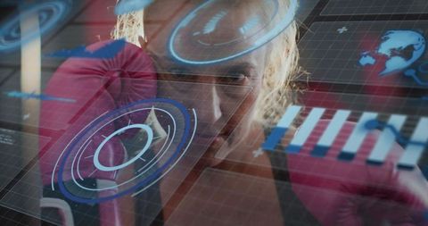 Female boxer training with augmented reality hud overlays wearing pink gloves in gym