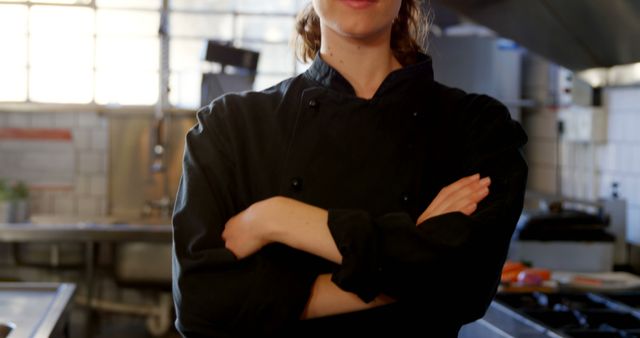 Confident Chef Standing in Professional Kitchen with Arms Crossed - Download Free Stock Images Pikwizard.com