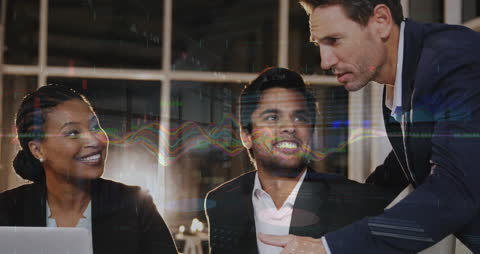 Diverse Team Analyzing Financial Data Overlaid with Digital Interface