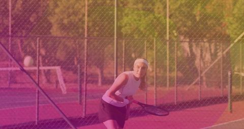 Female Tennis Player Returning Shot on Outdoor Court
