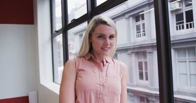 Portrait of a Young Professional Woman Smiling in Modern Office - Download Free Stock Images Pikwizard.com