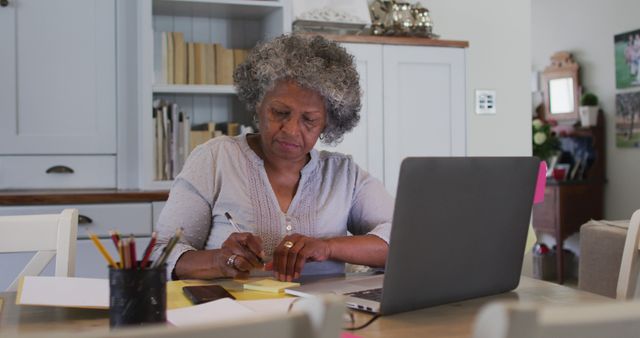 Senior Woman Working From Home with Laptop in Cozy Living Room - Download Free Stock Images Pikwizard.com