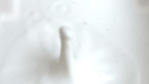 Raspberry Under Slow Motion Milk Drop Mid Falling Impact