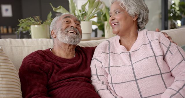 Happy Senior Couple Relaxing on Couch at Home - Download Free Stock Images Pikwizard.com