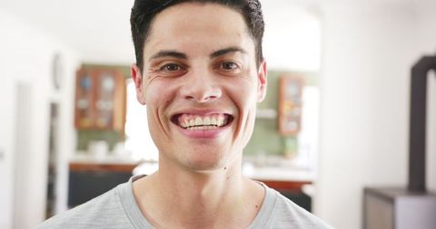Joyful Man Smiling at Home in Casual Setting - Download Free Stock Images Pikwizard.com